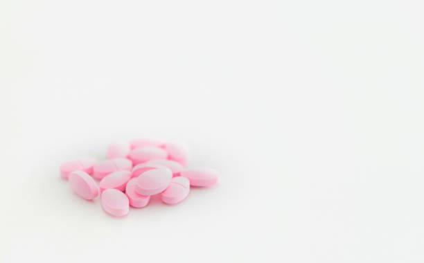 istock pink pills for medical treatment isolated on white 1370512863