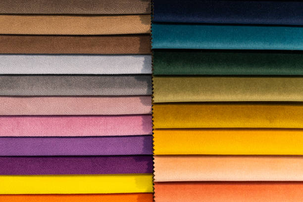 istock Tissue catalog. Catalog of multi-colored fabric samples. Textile industry background. Colored cotton fabric. 1370513068