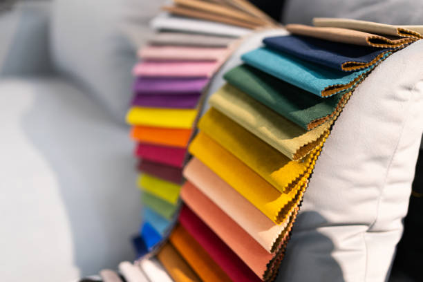 istock Tissue catalog. Catalog of multi-colored fabric samples. Textile industry background. Colored cotton fabric. 1370513073