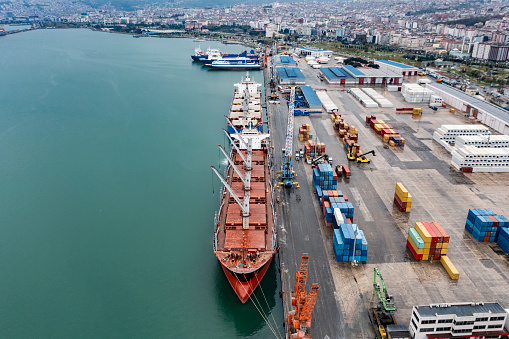 Aerial view of cargo ship at port.