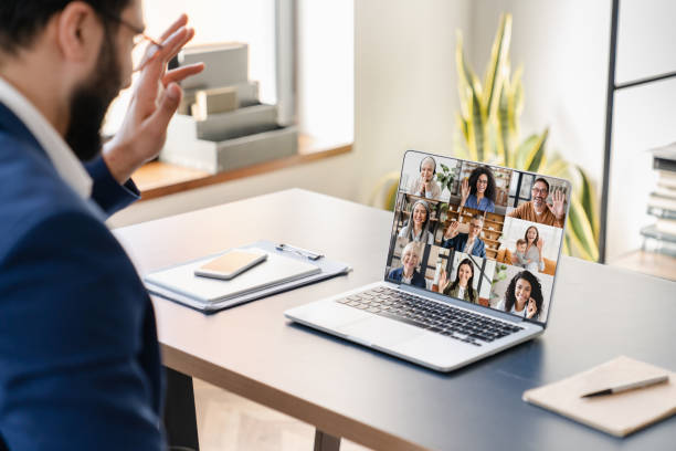 istock Middle-Eastern businessman boss CEO freelancer tutor teacher calling having videocall conference meeting conversation online with colleagues on laptop. Remote work job, occupation on distance concept 1370516276