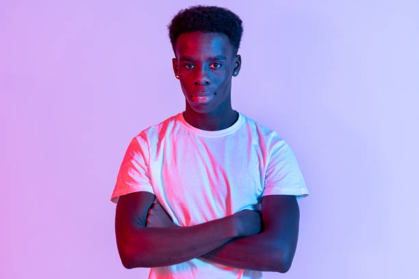 istock Front portrait of young man with folded arms 1370517074