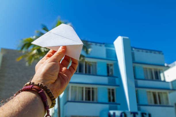 POV Point of view shot of a young travel male enjoying his vacations while playing with a paper airplane in front of Ocean Drive, South Beach, Miami Beach, Miami, South Florida, United States of America. Travel Concept. POV Point of view shot of a young travel male enjoying his vacations while playing with a paper airplane in front of Ocean Drive, South Beach, Miami Beach, Miami, South Florida, United States of America
The picture is in the famous and touristic Art Deco District. Shooting from a personal perspective in an exotic tropical beach travel holidays.
Travel Concept. 1 hotel south beach stock pictures, royalty-free photos & images