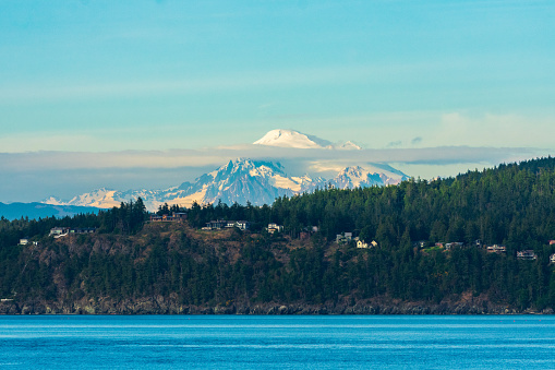 Houses line the bluff with Mount Baker looming in the background