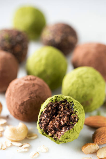 istock Vegan chocolate truffles with nuts and green tea Matcha 1370519478