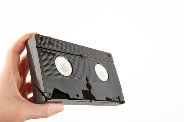 istock image of vhs tape hand white background 1370520396