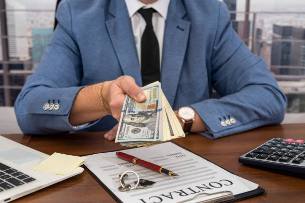 istock businessman man in a stylish clean suit working on a very important work contract. 1370521134