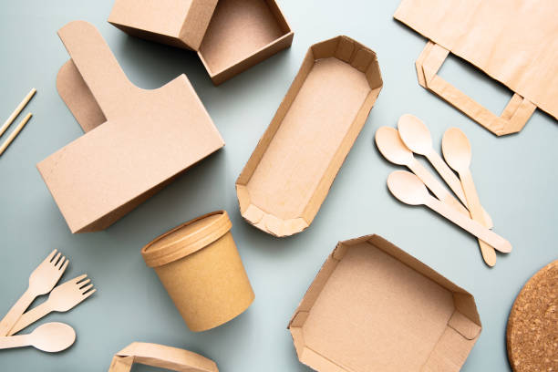 istock Zero waste, environmentally friendly, disposable, cardboard, paper utensils, view from the top. Eco craft paper tableware. 1370523297