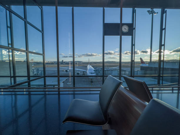 istock Aircraft parked at airport gate 1370524053