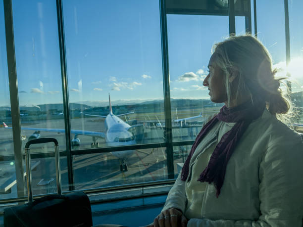 istock Young woman waiting for connecting flight 1370524105