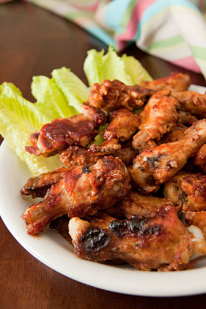 istock Barbecue chicken wings on a bed of lettuce 137052451
