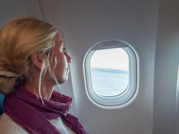 istock Woman looking out of window 1370524602