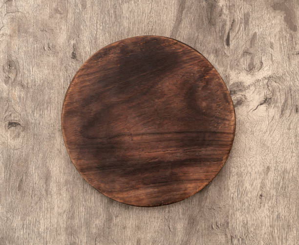 istock Empty wooden board over wooden table with copy space 1370524774