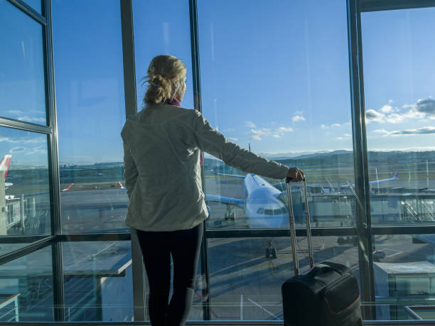 istock Young woman waiting for connecting flight 1370524807