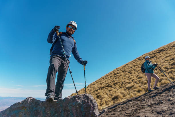 istock Two female hikers enjoying valley view 1370527240