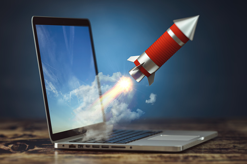 Rocket launch from laptop. Launching start up or new business project. 3d illustration