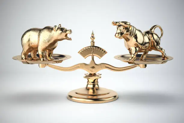 Photo of Bull and bear on a scales. Bearish or bullish market on stock exchange concept.