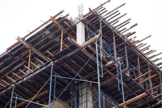 istock View up corner of building construction site and frame in Bangkok 1370527730