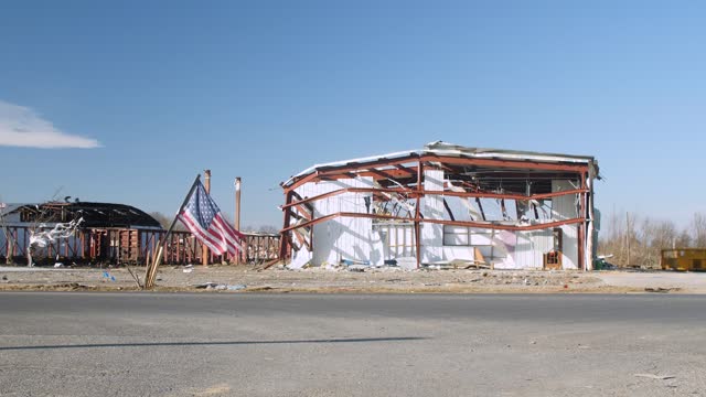 Mayfield Kentucky damaged building with American flag