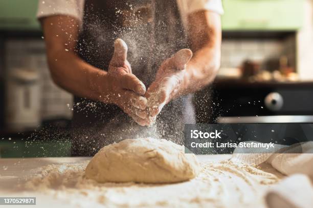 Chefs Hands Spraying Flour Over The Dough Stock Photo - Download Image Now - Bakery, Baker - Occupation, Cooking Class