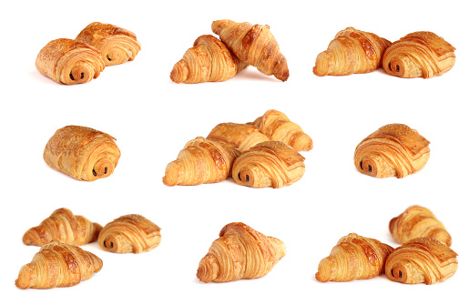 Groupe of french croissants and pain au chocolate isolated on white background. French bakery - viennoiserie collection.