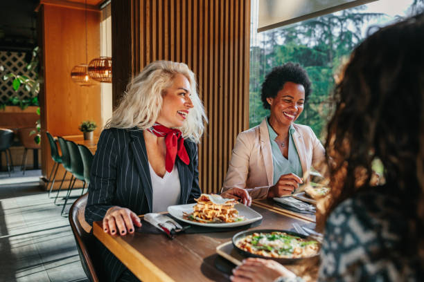 istock Female friends having a great time in cafe 1370531317