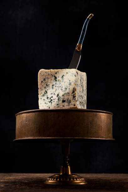 block of blue mold cheese on dark background. blue cheese dark rustic food photography. - farmers cheese imagens e fotografias de stock