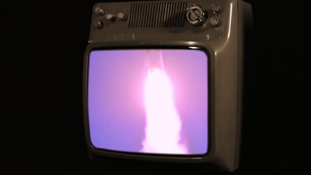 Apollo 11 Launch on an Old Television Set. Sepia Tone. Elements of this video furnished by NASA.