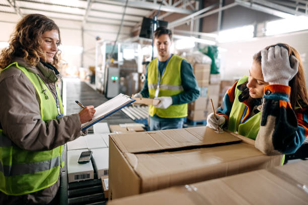 istock Male and female workers at distribution center 1370535020