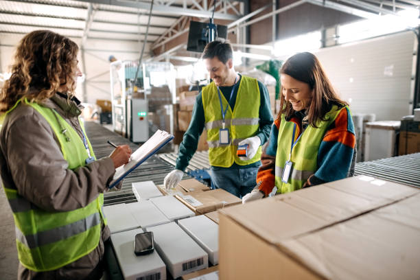istock Male and female workers at distribution center 1370535023