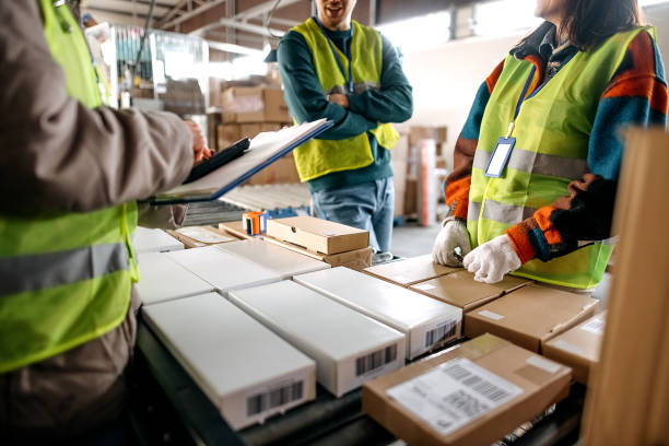 istock Male and female workers at distribution center 1370535103