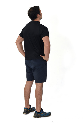 rear view of a man with sportwear on white background