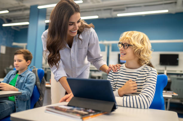 istock Woman and boy smiling looking at each other 1370537126