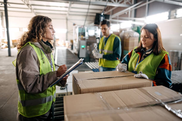 istock Male and female workers at distribution center 1370537187