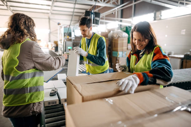 istock Male and female workers at distribution center 1370537279