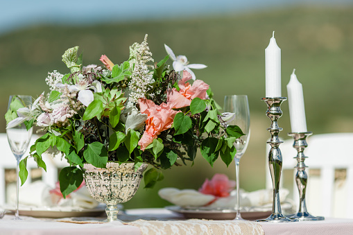 Elegant Outdoor Table Setting with Candles and Fresh Flowers in Kiowa, Colorado, United States