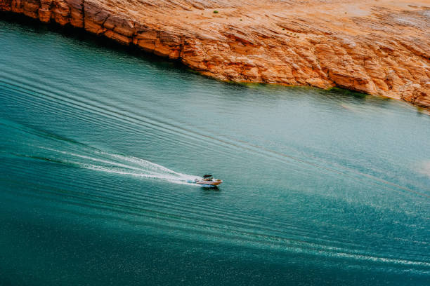 Motor boat on Lake Powell. Beautiful turquoise colored water, an Motor boat on Lake Powell. Beautiful turquoise colored water, an in Lake Powell, Arizona, United States lake powell stock pictures, royalty-free photos & images