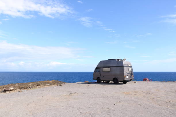 istock Recreational vehicle, camping at the beach 1370541988