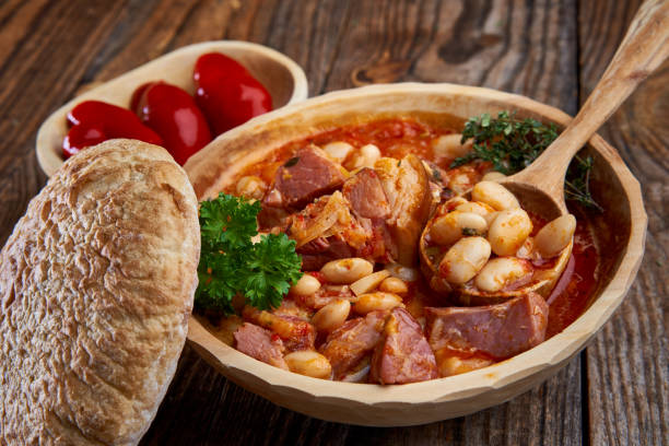istock Smoked pork and beans stew on a rustic table 1370542959