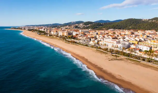Bird's eye view of shoreline and beach of Malgrat de Mar, Spain.