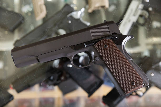 istock Pneumatic weapon on glass table in army store 1370546600