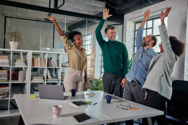 istock Celebrations in office after successful business team 1370549268