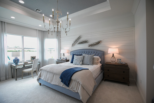 Beautifully decorated master bedroom in new home.