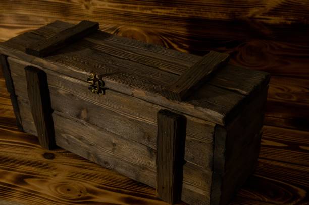istock Antique wooden box in a low key on the boards. 1370554210
