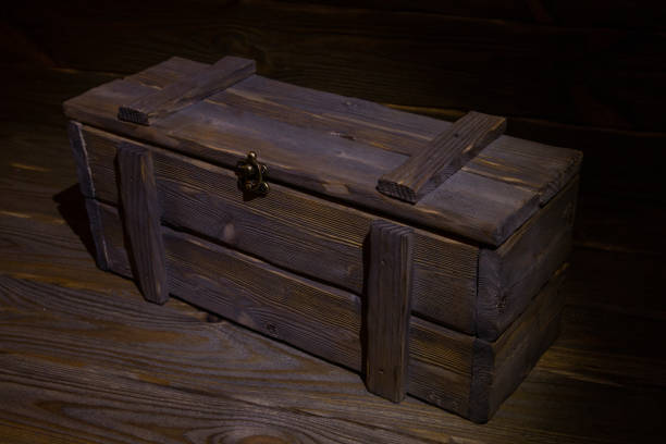 istock Antique wooden box in a low key on the boards. 1370554312