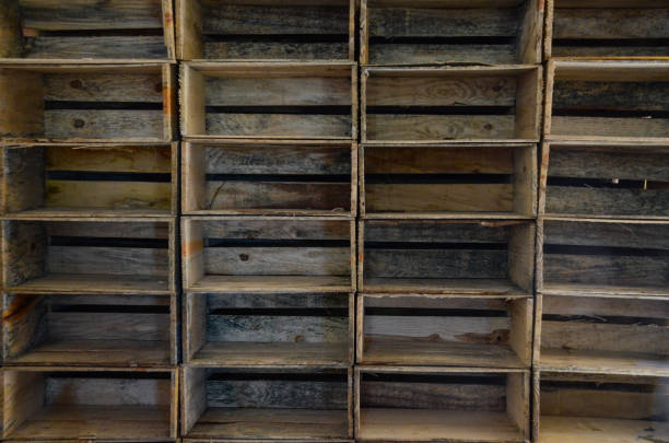 Set of wooden boxes, all stacked and empty, used for the storage and transport of produce