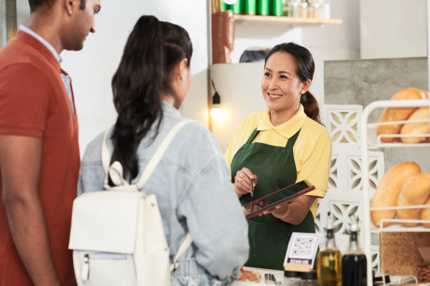 Coffeeshop Worker Talking to Customers