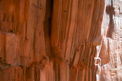 textures of various clay layers underground in  clay quarry after  geological study of the soil. colored layers of clay and stone in  section of the earth, different rock formations and soil layers.