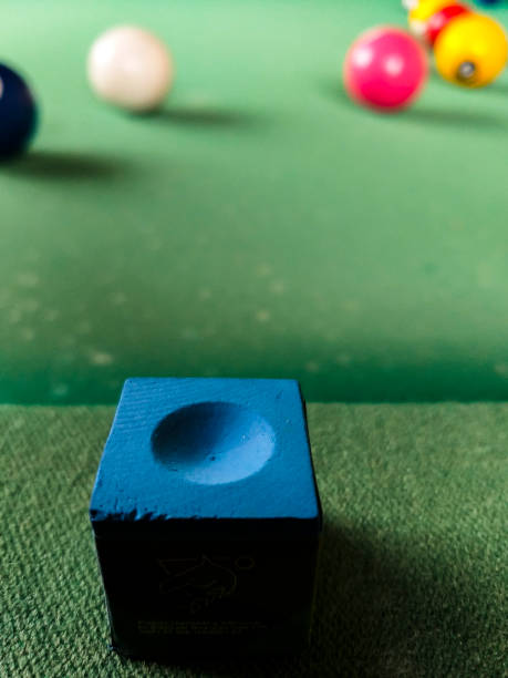 istock Green pool table with some balls in the background 1370557983
