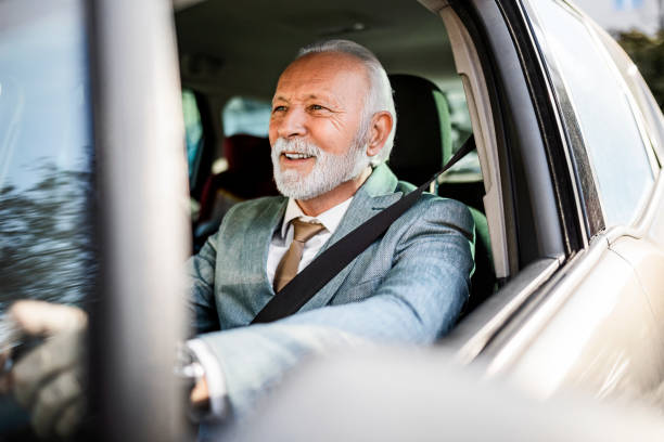 istock Senior man driving looking in front of car 1370559793